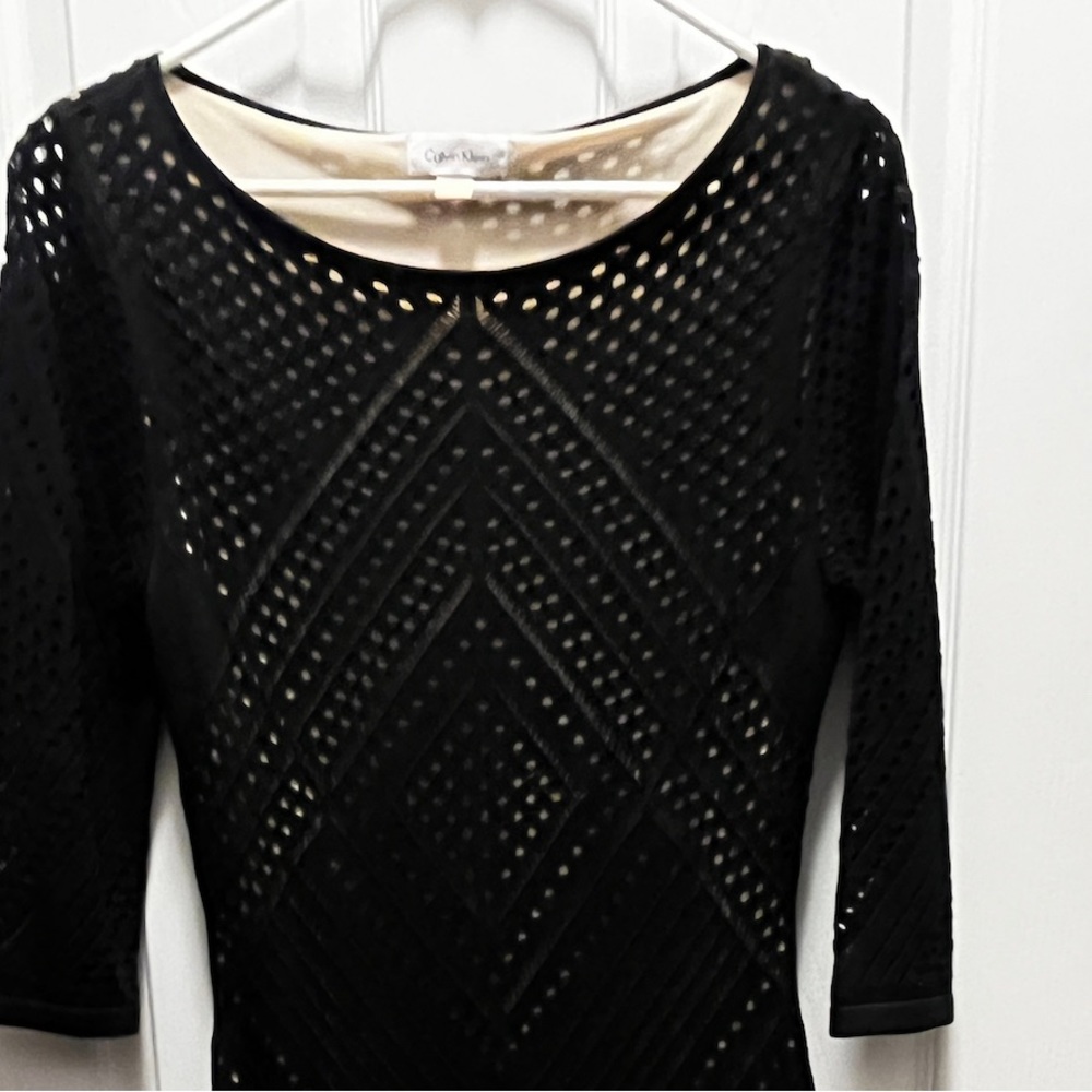 Figure-flattering black dress with nude underlay